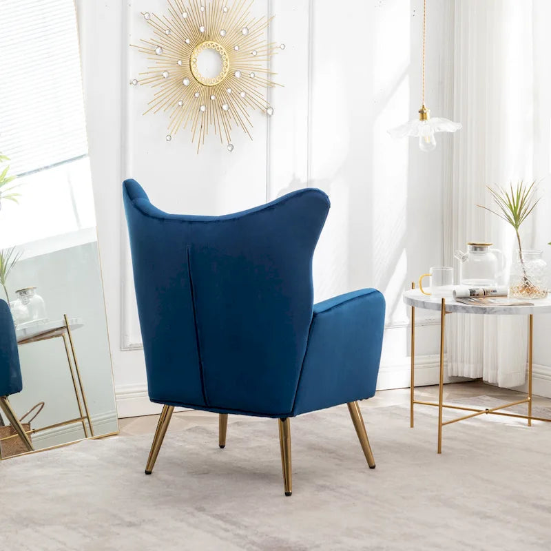 Fauteuil d’appoint à dossier haut et ailes, capitonné avec boutons, en velours