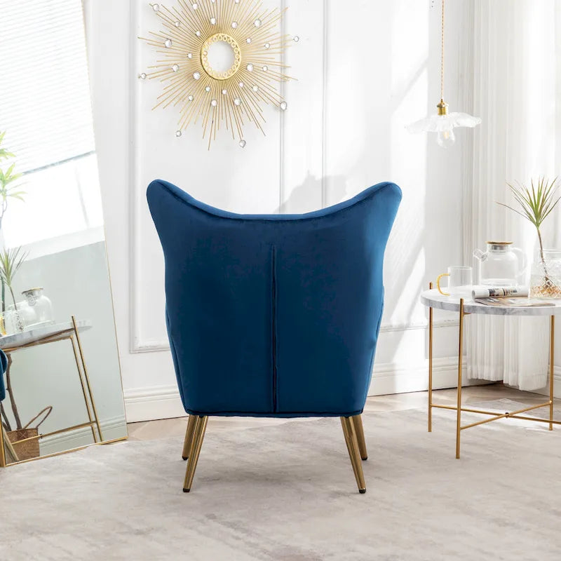 Fauteuil d’appoint à dossier haut et ailes, capitonné avec boutons, en velours