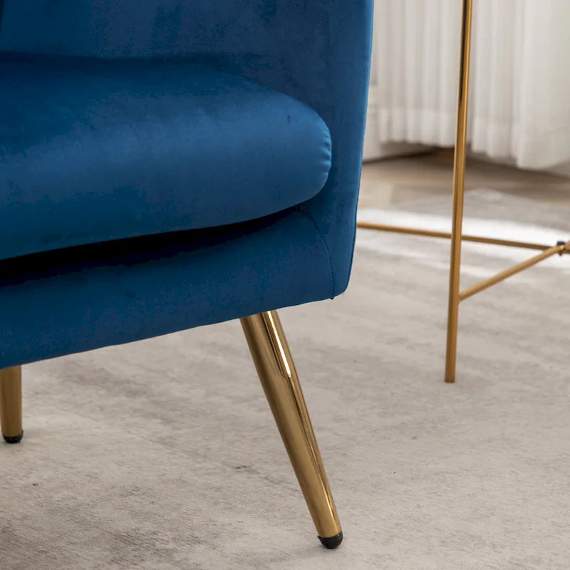 Fauteuil d’appoint à dossier haut et ailes, capitonné avec boutons, en velours
