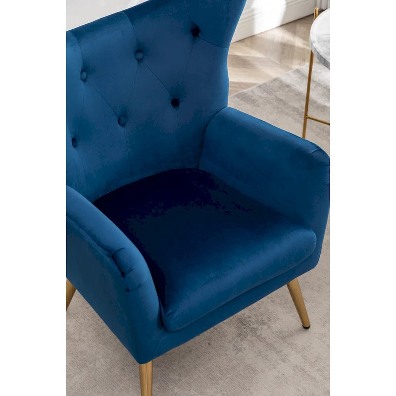 Fauteuil d’appoint à dossier haut et ailes, capitonné avec boutons, en velours