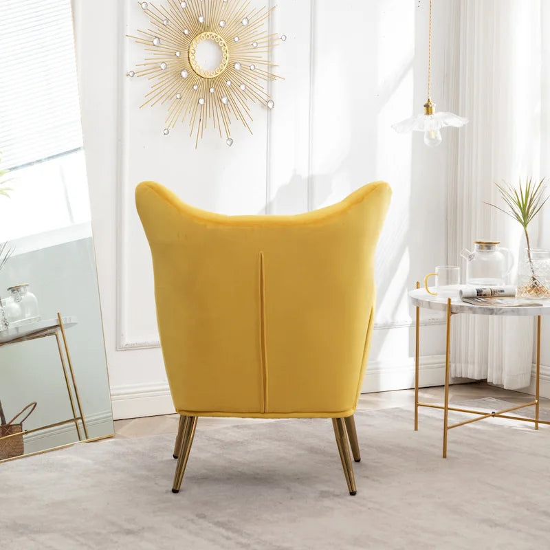 Fauteuil d’appoint à dossier haut et ailes, capitonné avec boutons, en velours