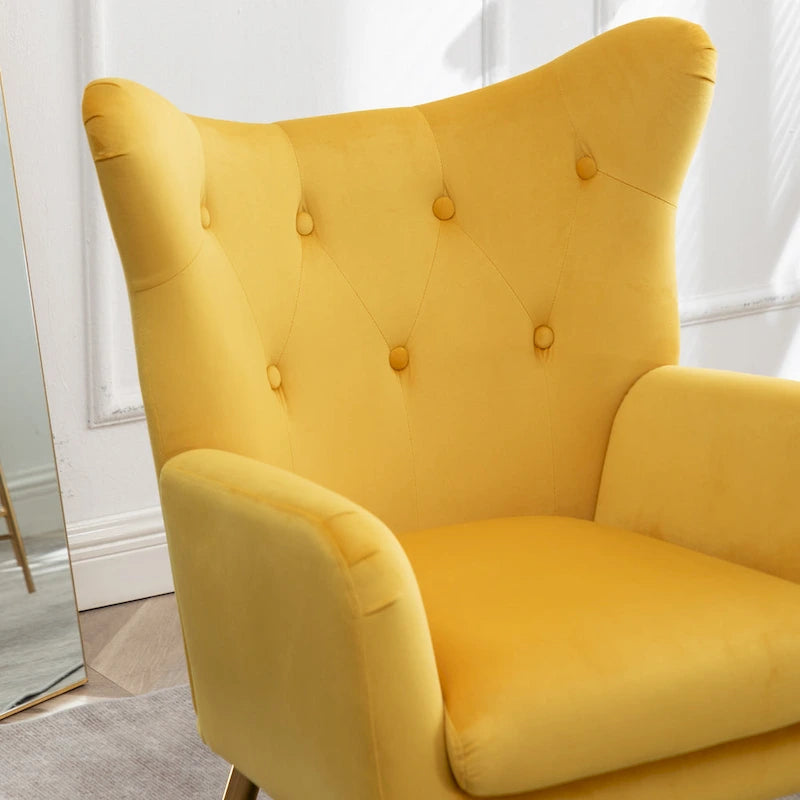 Fauteuil d’appoint à dossier haut et ailes, capitonné avec boutons, en velours