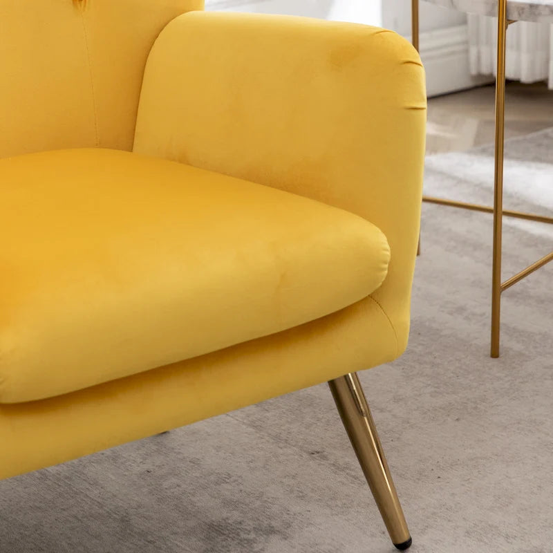 Fauteuil d’appoint à dossier haut et ailes, capitonné avec boutons, en velours